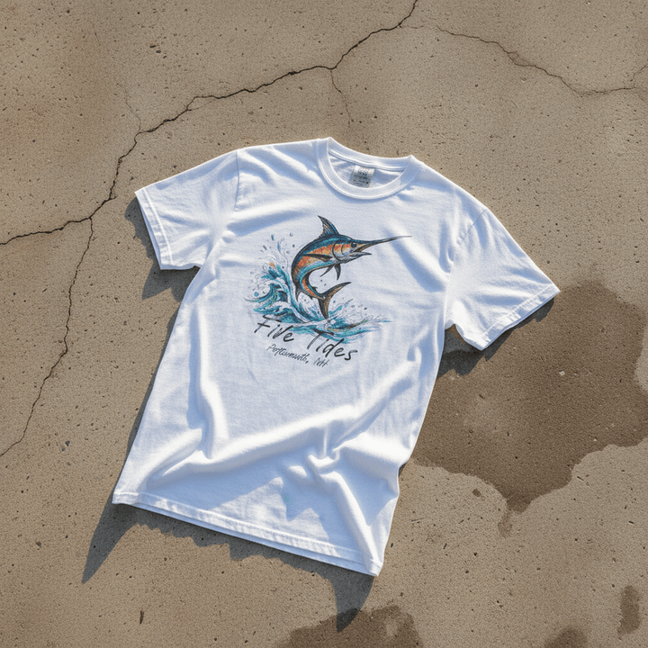 Marlin Surf white garment-dyed tee on light cracked cement with wet marks