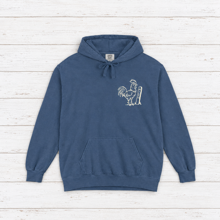 Rooster Surf hoodie flat lay on whitewashed boards
