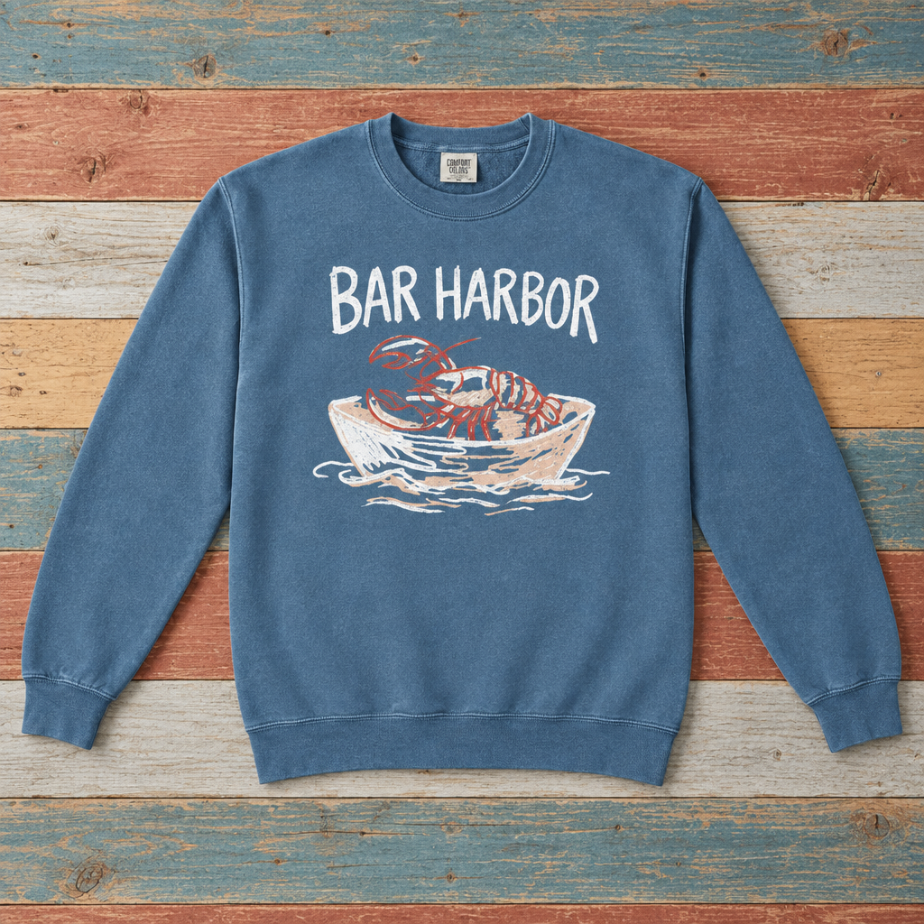 Bar Harbor lobster boat sweatshirt front in Blue Jean on colorful weathered driftwood boards