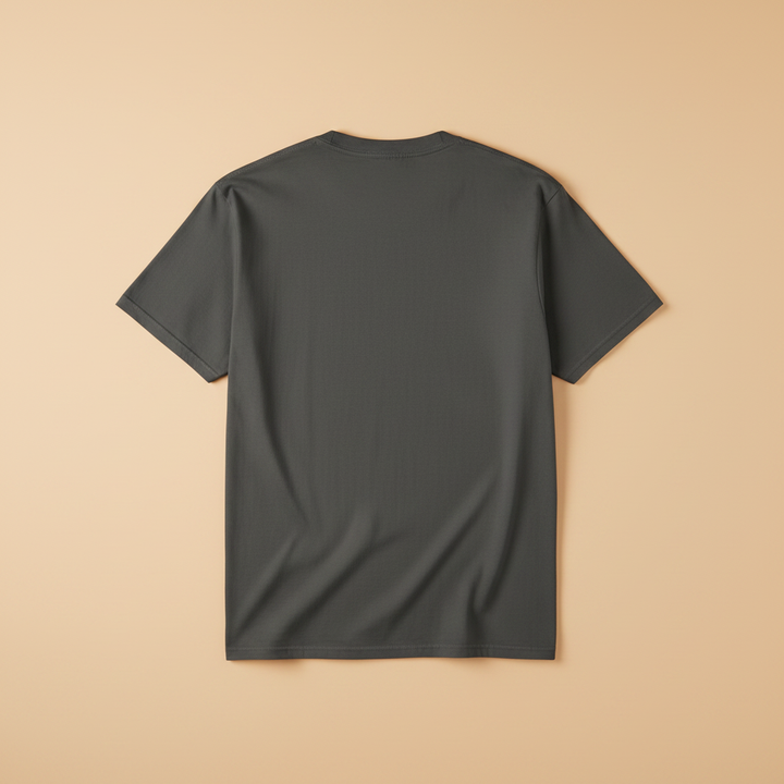 Saltwater Surf Club Tee in Pepper/Charcoal — plain back, warm sand studio background