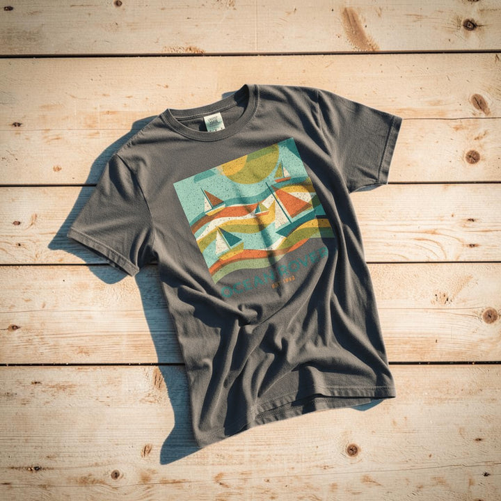 Ocean Rovers graphite garment-dyed tee on light cracked cement with wet marks