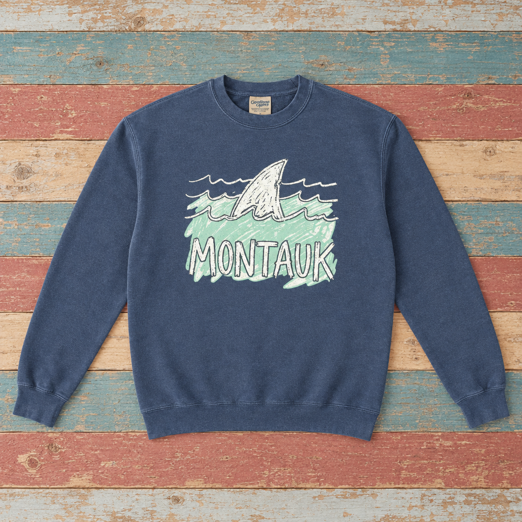 Montauk shark sweatshirt front in Denim with sea-green waves on colorful weathered driftwood boards