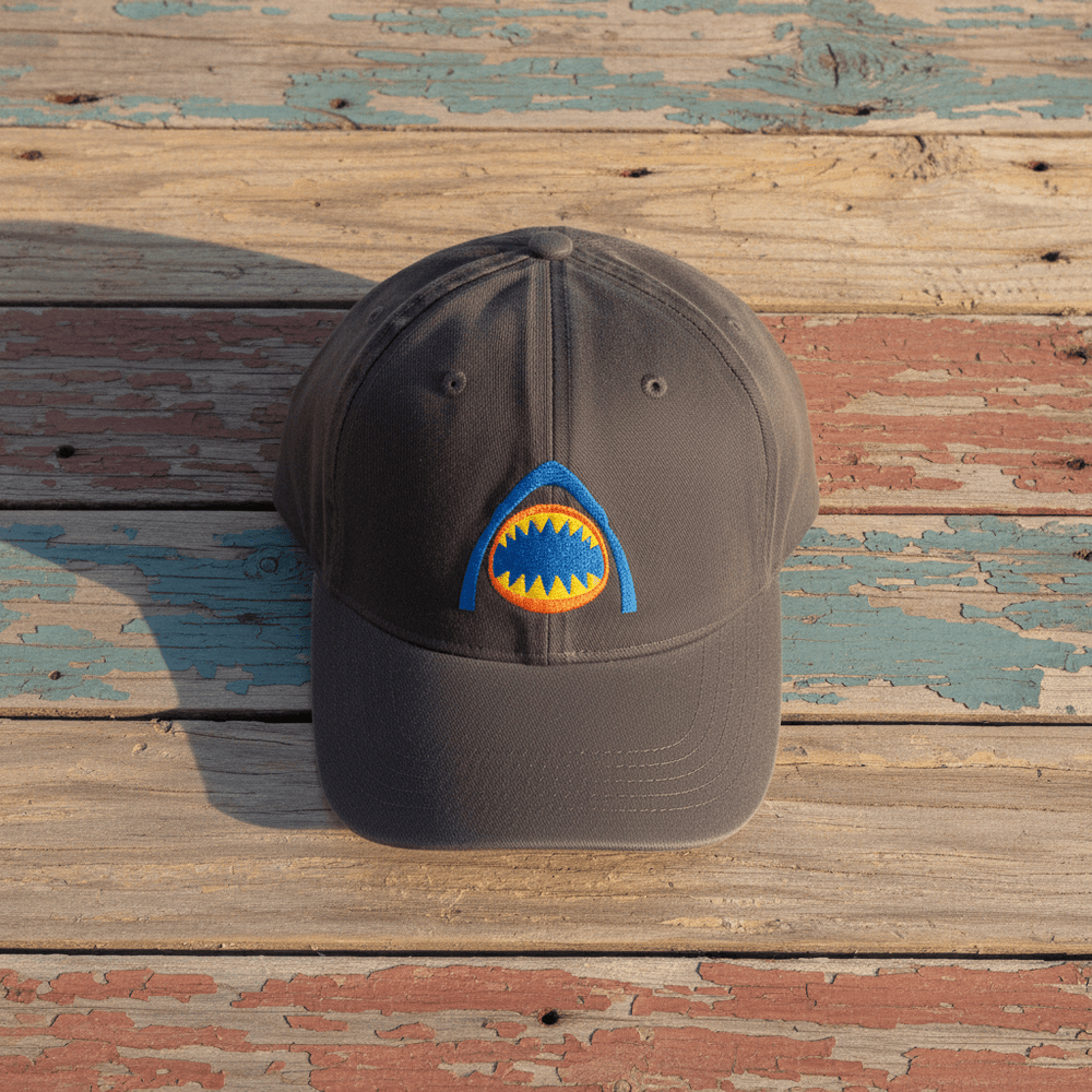 Shark Bite Retro Embroidered Cap dark grey on faded driftwood planks
