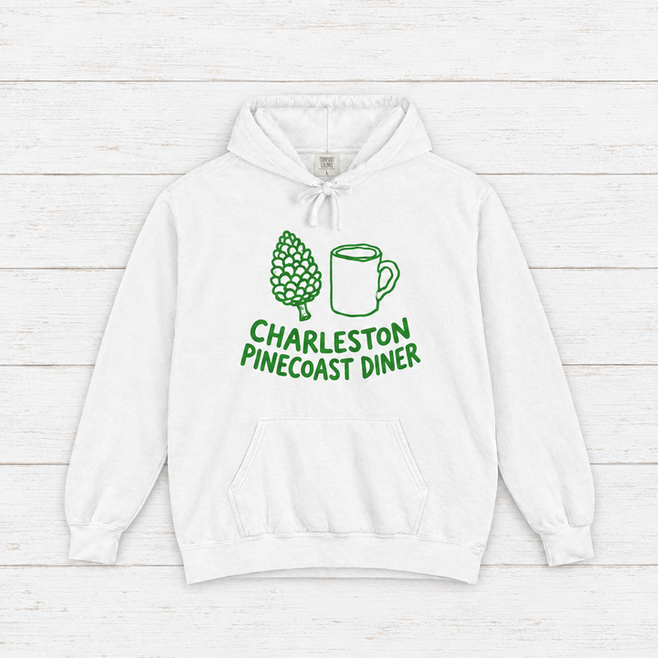 Pinecoast Diner hoodie flat lay on whitewashed boards