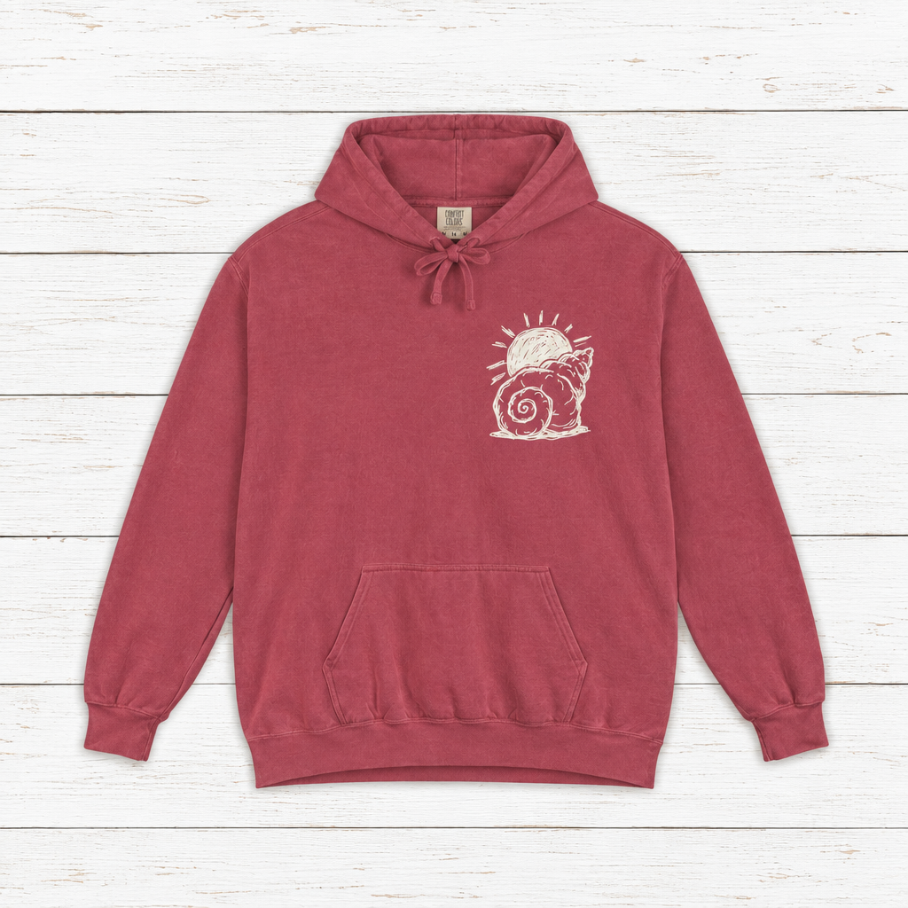 Beach Snail hoodie flat lay on whitewashed boards