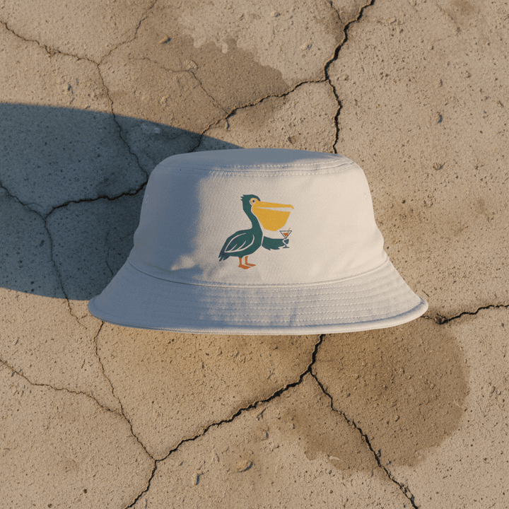 Pelican Cocktail storm bucket hat on light cracked cement with wet marks