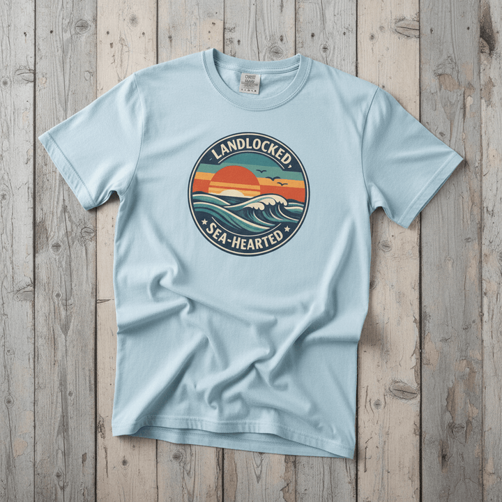 Landlocked Sea-Hearted Sunset chambray garment-dyed tee on faded driftwood planks