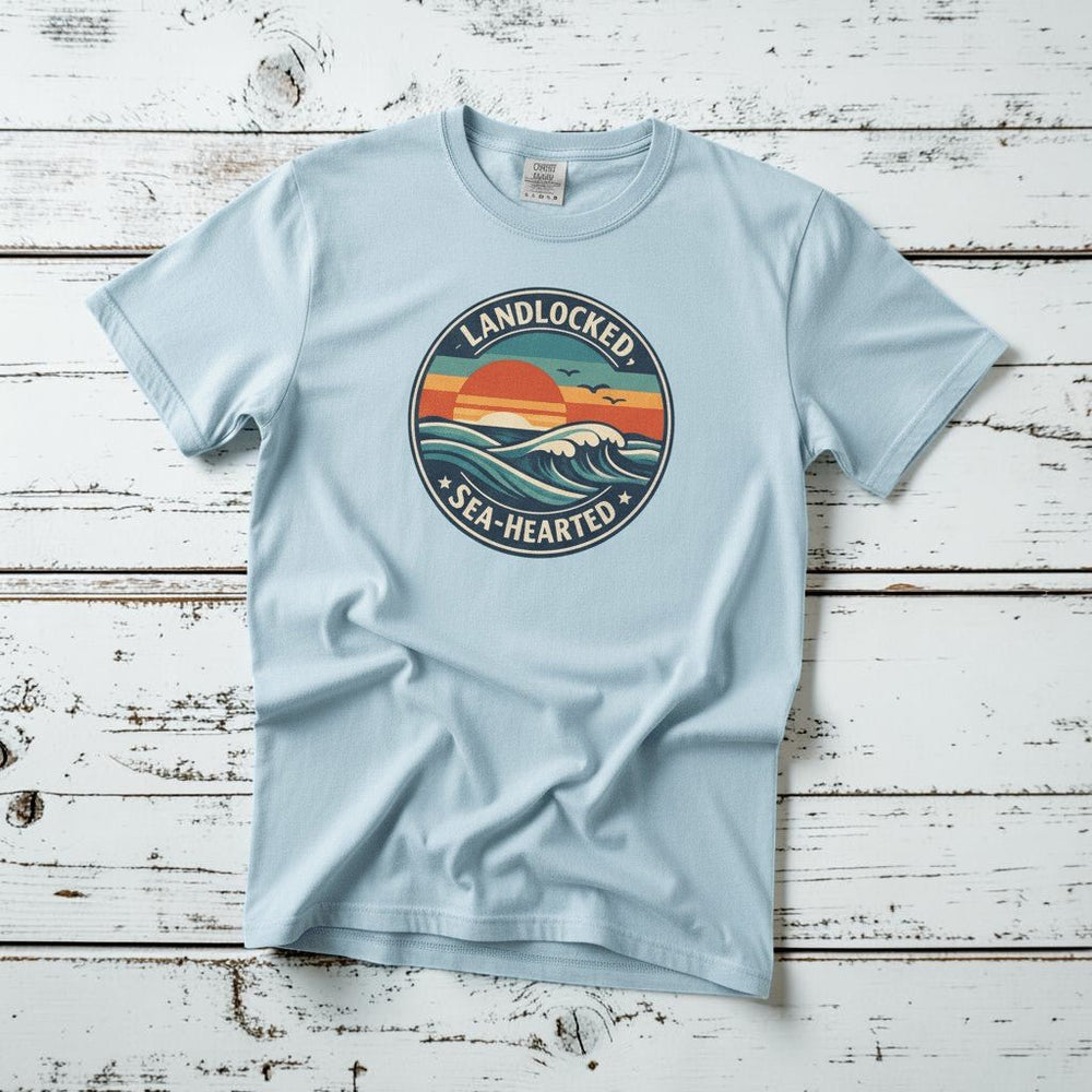 Landlocked Sea-Hearted Sunset chambray garment-dyed tee on faded driftwood planks