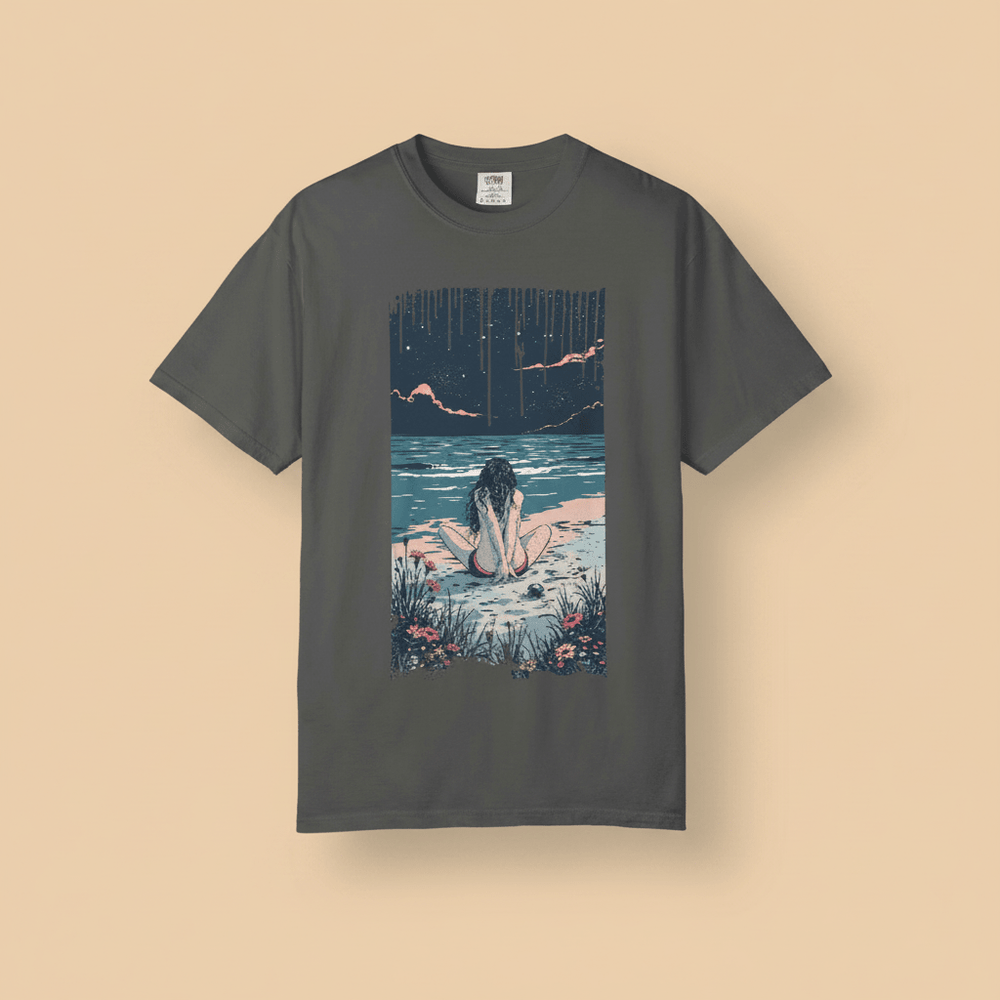Anime Beach Tee in Pepper/Charcoal — front graphic, warm sand studio background