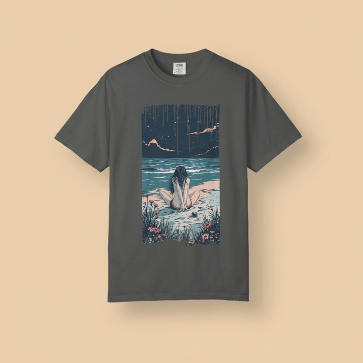 Anime Beach Tee in Pepper/Charcoal — front graphic, warm sand studio background
