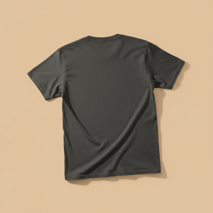 Anime Beach Tee in Pepper/Charcoal — plain back, warm sand studio background