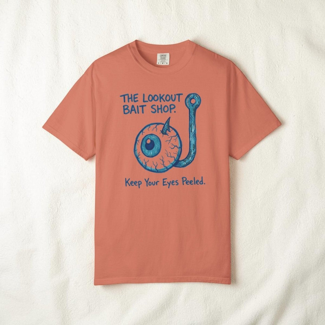 Coral t-shirt with blue fishing hook graphic and text on a white background