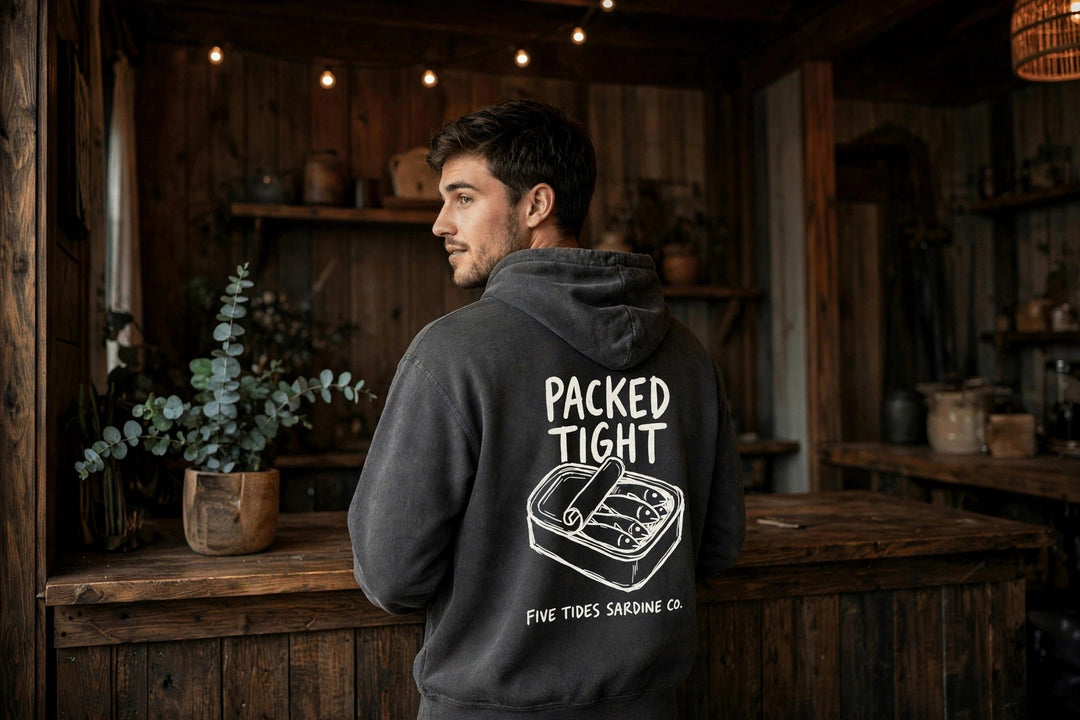 Sardine Co. Logo Hoodie — in the Five Tides room, male back