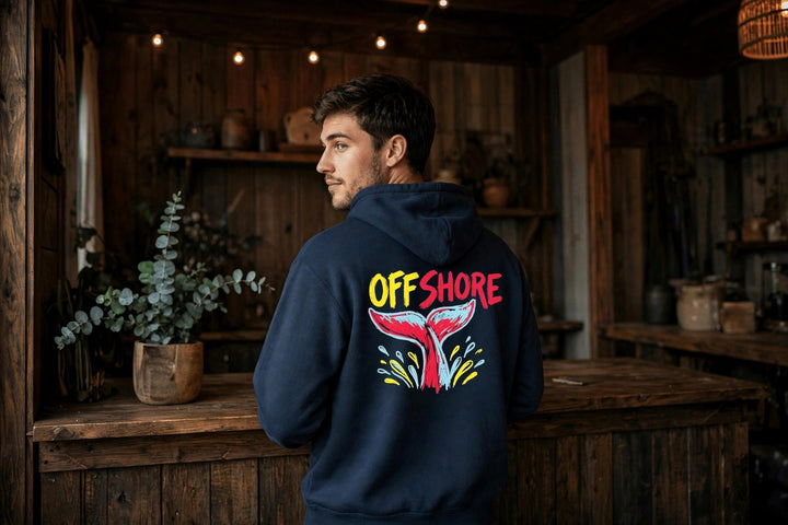 Offshore Whale Tail Hoodie — in the Five Tides room, male back