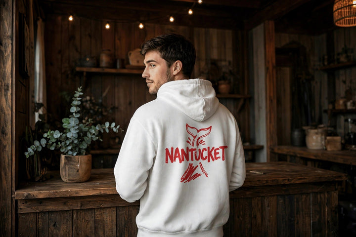 Nantucket Whale Tail Hoodie — in the Five Tides room, male back