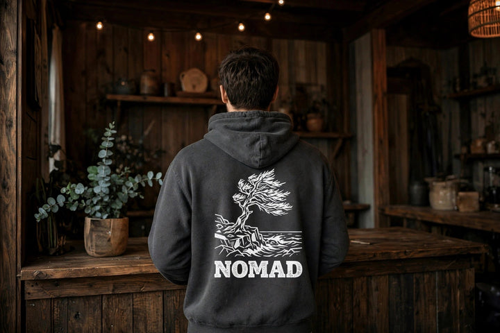 Nomad Windswept Tree Hoodie — in the Five Tides room, male back