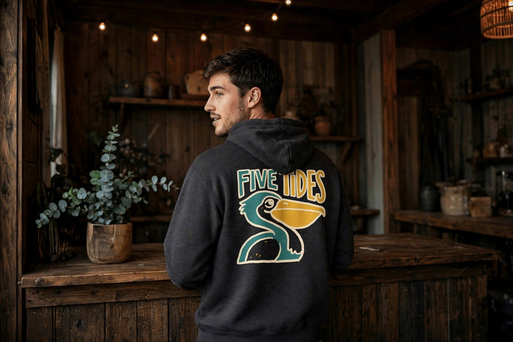 Pelican Coastal Hoodie — in the Five Tides room, male back