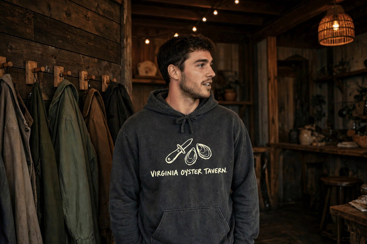 Virginia Oyster Tavern Hoodie — in the Five Tides room, male front