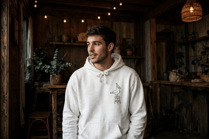Cape May Dive Bar Hoodie — in the Five Tides room, male front