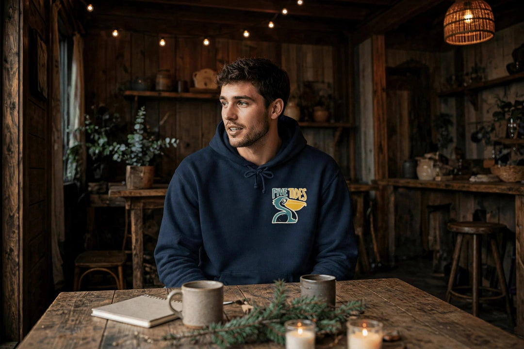 Low Tide Vibe Pelican Hoodie — in the Five Tides room, male front