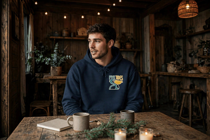 Low Tide Vibe Pelican Hoodie — in the Five Tides room, male front