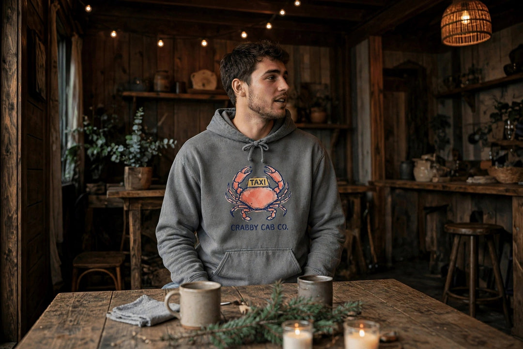 Crabby Cab Co. Crab Taxi Hoodie — in the Five Tides room, male front