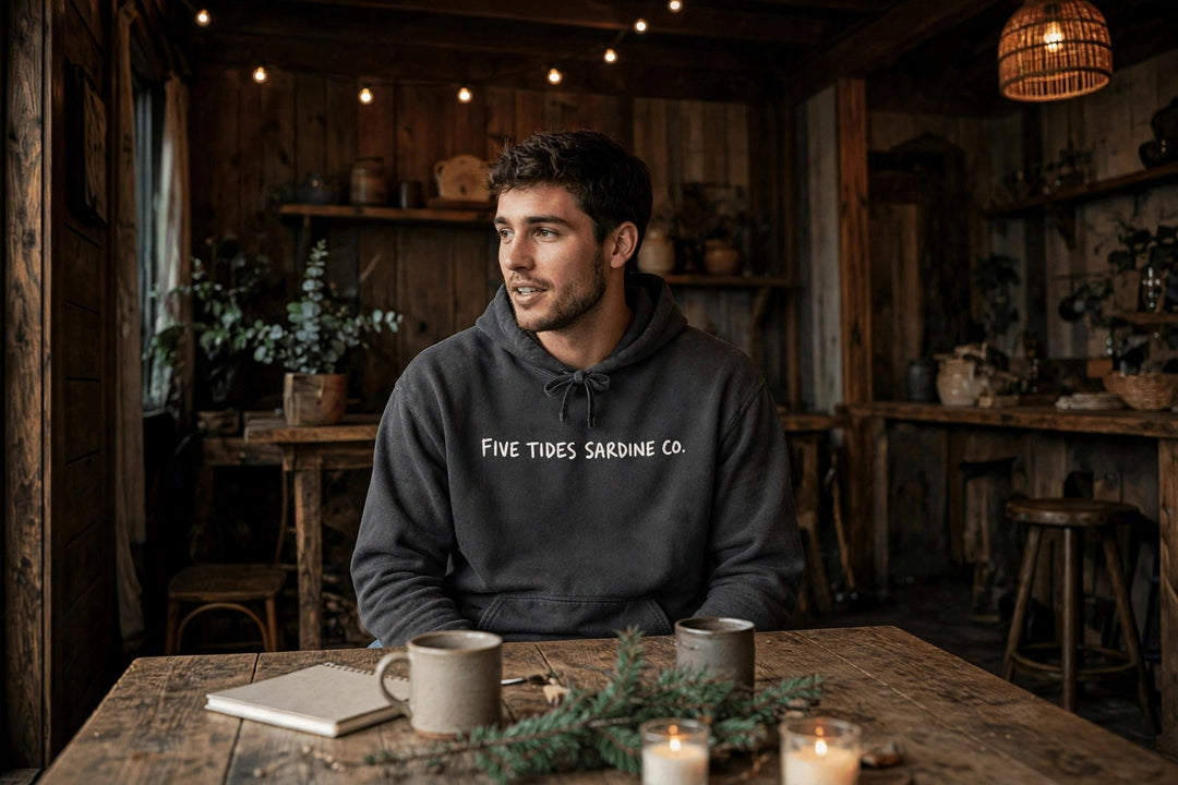 Sardine Co. Logo Hoodie — in the Five Tides room, male front