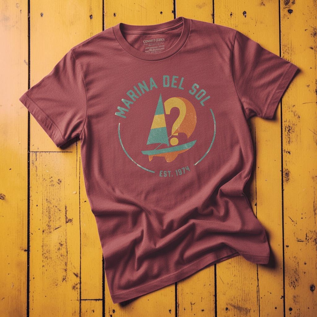 Marina Del Sol Sailboat chili garment-dyed tee on weathered wood planks
