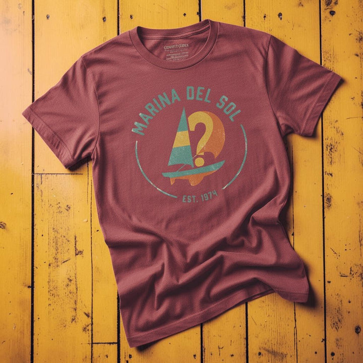 Marina Del Sol Sailboat chili garment-dyed tee on weathered wood planks