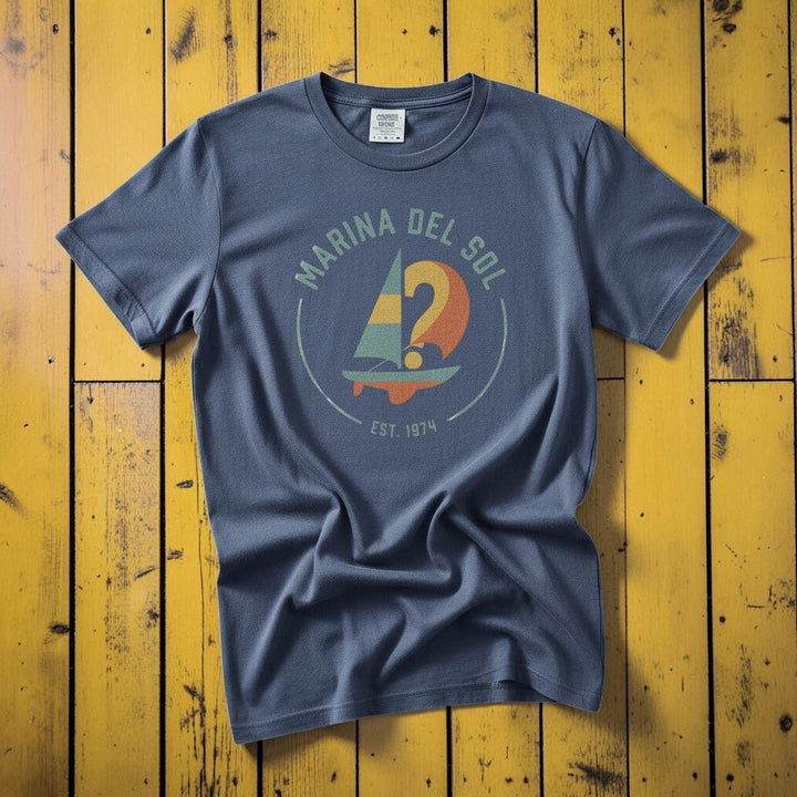 Marina Del Sol Sailboat denim garment-dyed tee on weathered wood planks