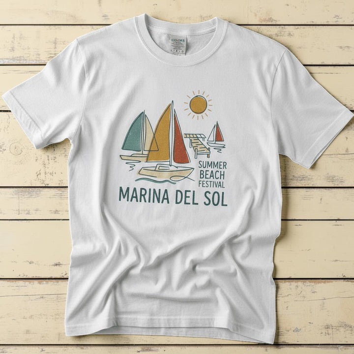 Marina Del Sol Sailboats white garment-dyed tee on weathered wood planks