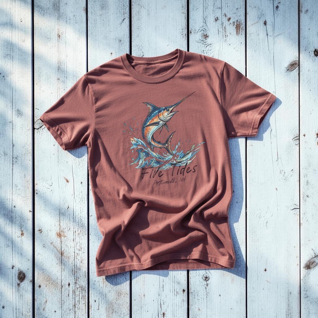 Marlin Surf brick garment-dyed tee on light cracked cement with wet marks