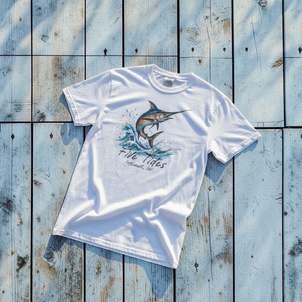Marlin Surf white garment-dyed tee on light cracked cement with wet marks