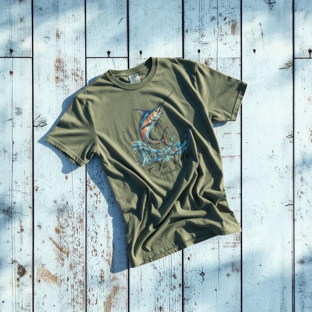 Marlin Surf sage garment-dyed tee on light cracked cement with wet marks