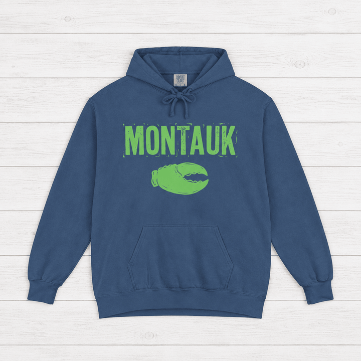 Denim Montauk hoodie front with distressed neon-green lettering and lobster-claw graphic by Five Tides Apparel