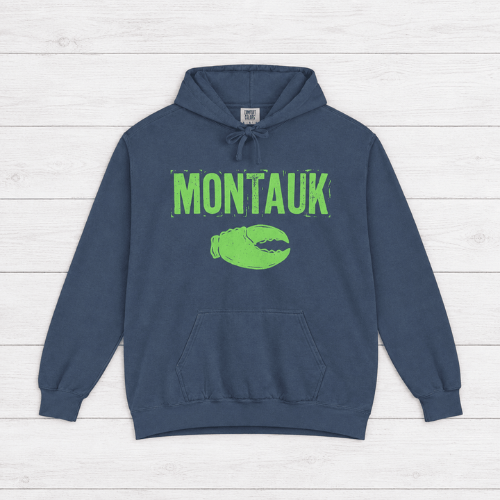 True Navy Montauk hoodie front with distressed neon-green lettering and lobster-claw graphic by Five Tides Apparel