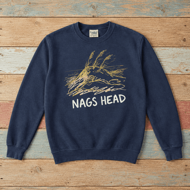 Nags Head crewneck front in True Navy with weathered-gold dune graphic on colorful weathered driftwood boards