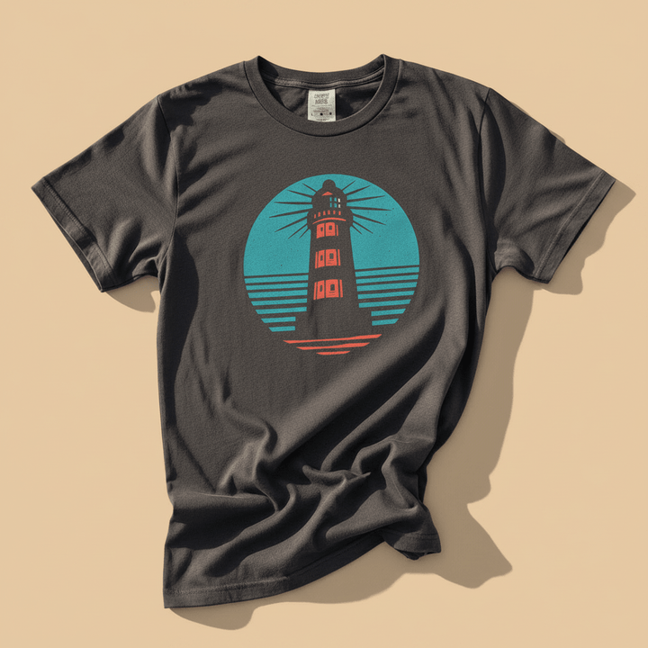 Nautical Lighthouse Tee in Graphite — front graphic, warm sand studio background