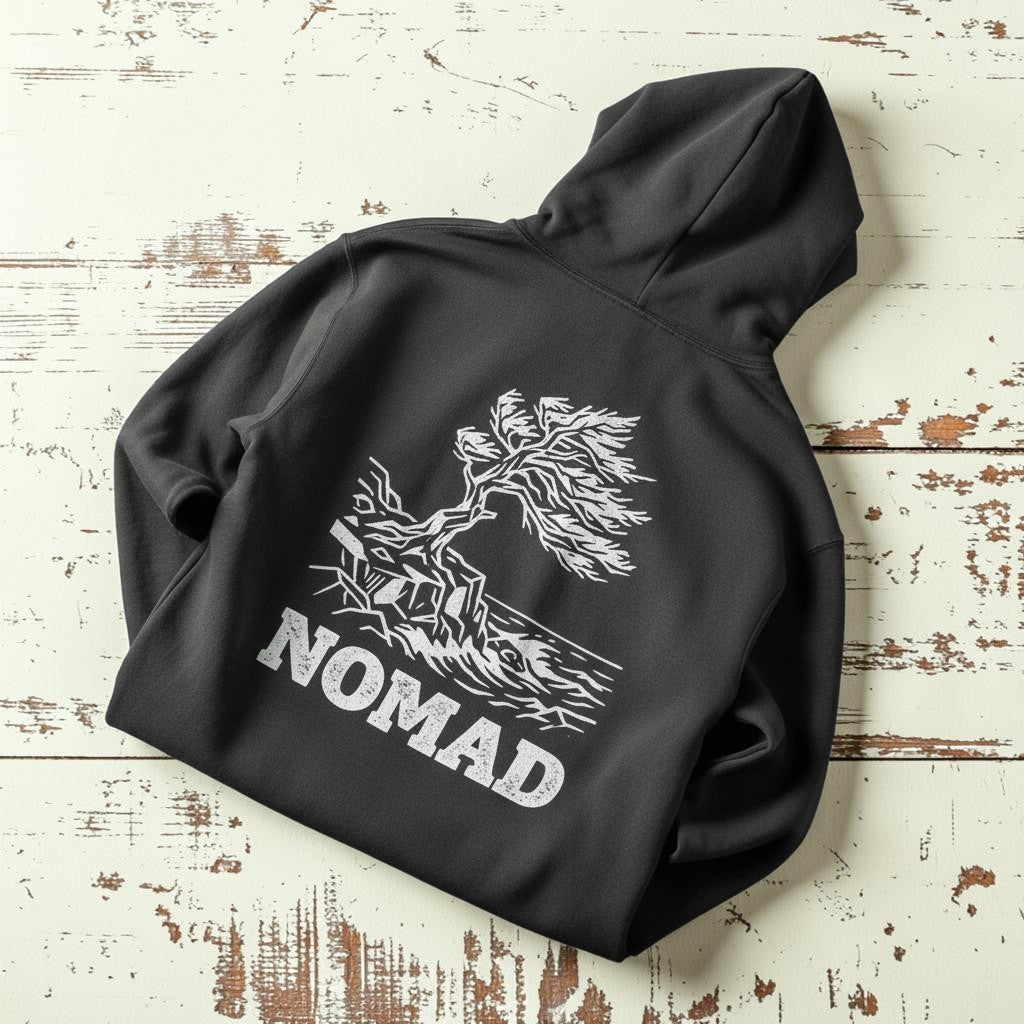 Nomad Garment-Dyed Hoodie in Pepper — back windswept tree graphic on driftwood