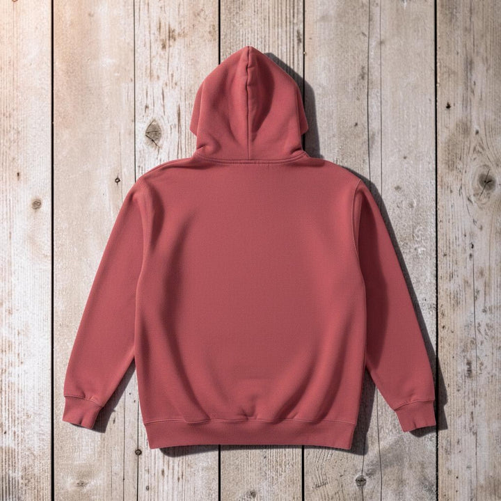 NOMAD Hoodie in Pink — plain back, warm sand studio background