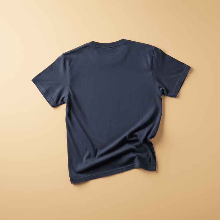 NOMAD Tee in China Blue/Navy — plain back, warm sand studio background