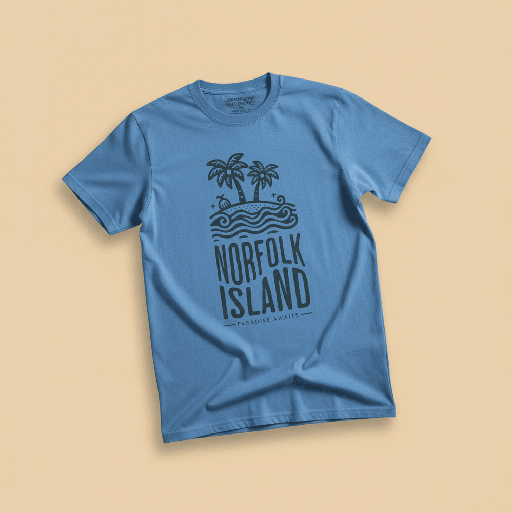 Norfolk Island Tee in Blue — front graphic, warm sand studio background