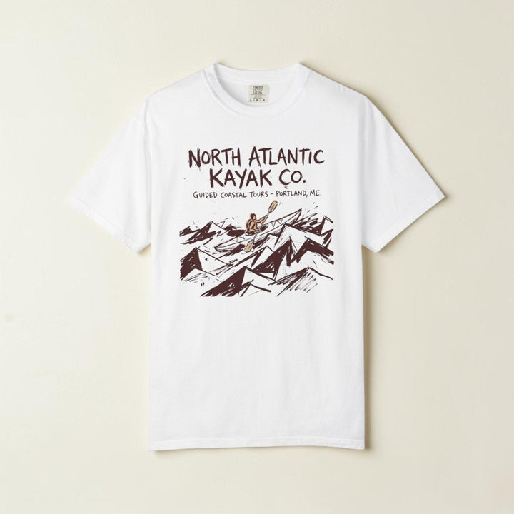 White t-shirt with North Atlantic Kayak Co. graphic design on a white background