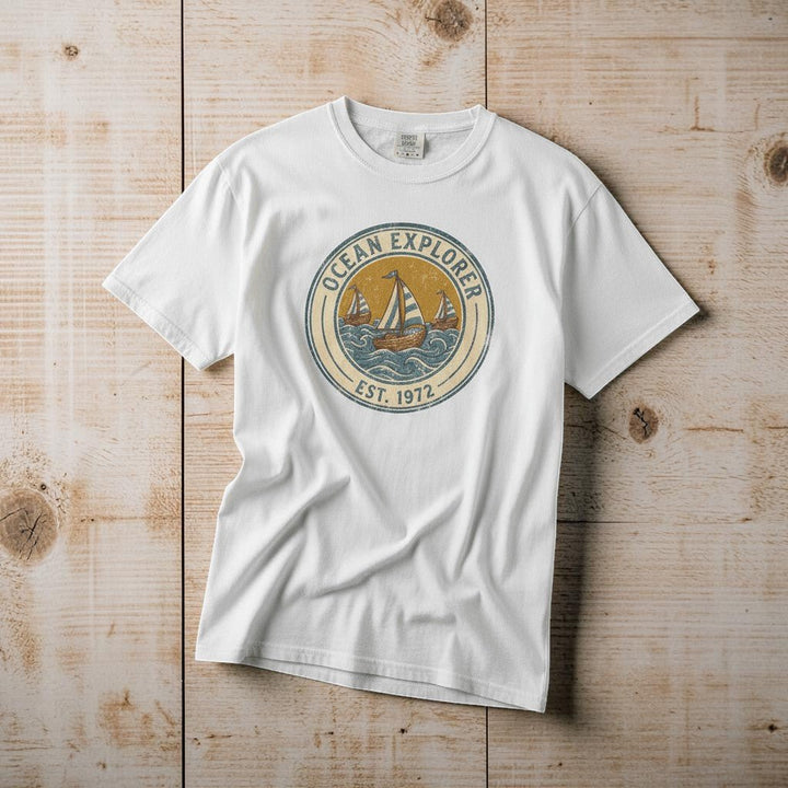 Ocean Explorer white garment-dyed tee casually tousled on rustic reclaimed wood