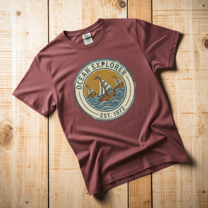Ocean Explorer brick garment-dyed tee casually tousled on rustic reclaimed wood