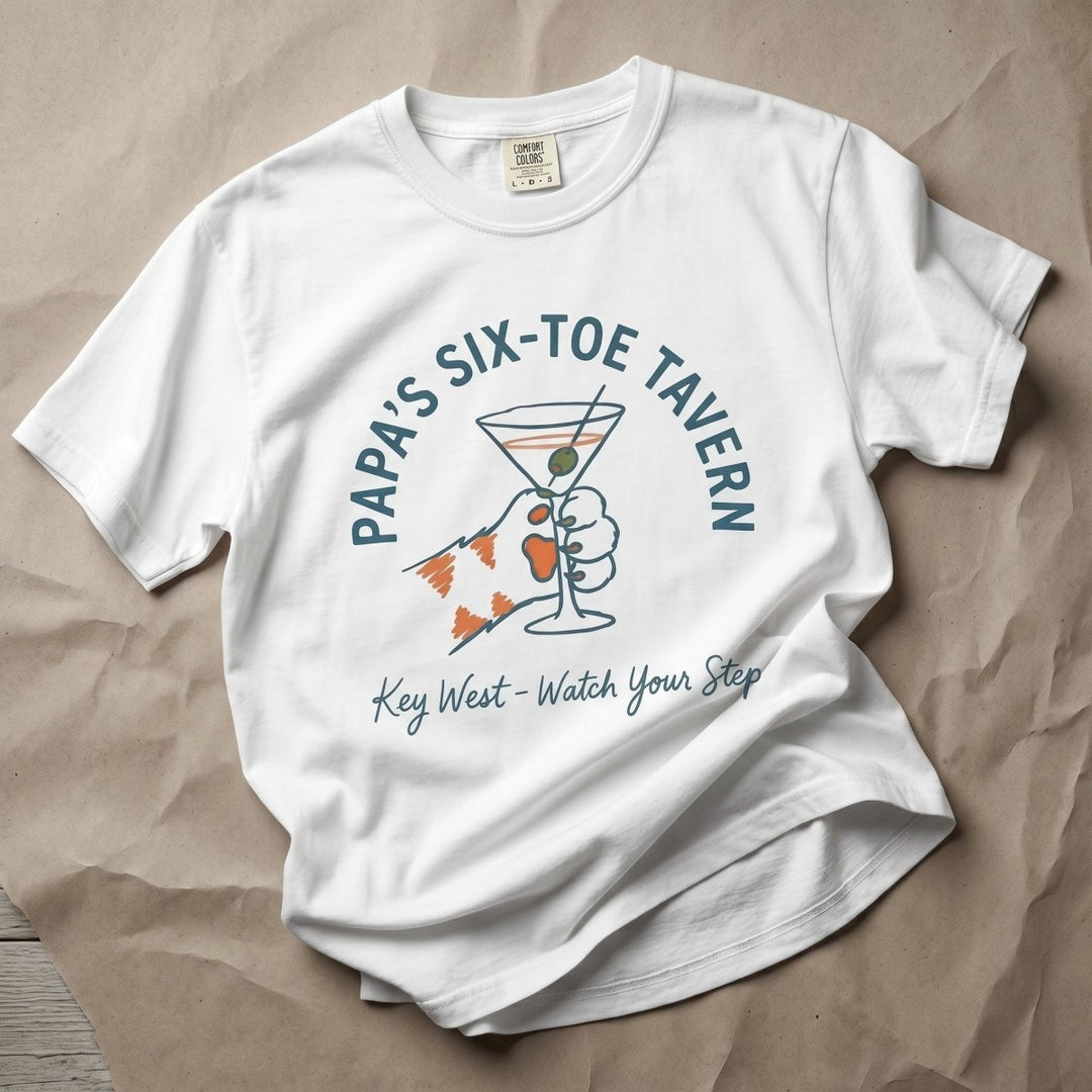 FIVE TIDES APPAREL white cotton t-shirt featuring a six-toed cat paw holding a martini glass graphic.