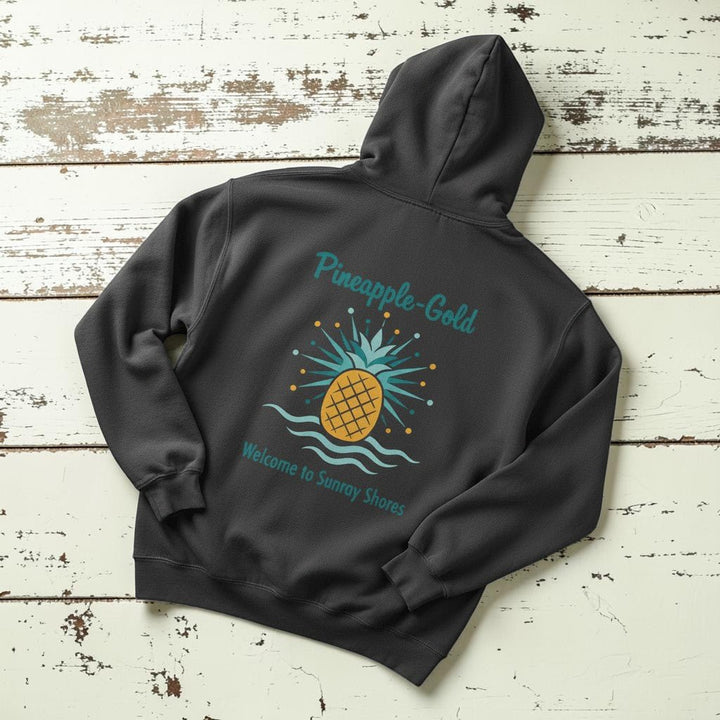 Pineapple-Gold Hoodie in Pepper — flat lay on warm sand studio background