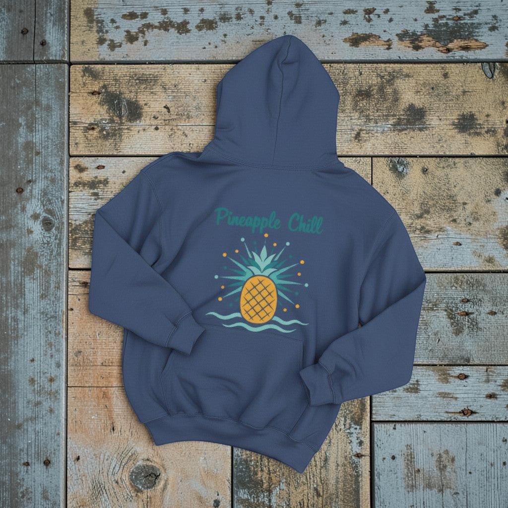 Pineapple Chill Hoodie in True Navy — flat lay on warm sand studio background