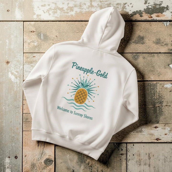 Pineapple-Gold Hoodie in White — flat lay on warm sand studio background