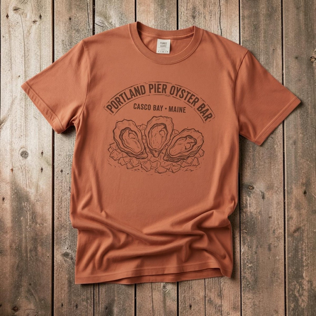 FIVE TIDES APPAREL terracotta garment-dyed cotton t-shirt featuring a vintage Portland Pier Oyster Bar graphic.